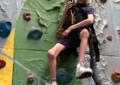 Harrison attends Kids Camp Holiday Club and enjoys rock climbing.
